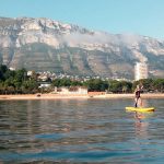 Person paddling stand at Denia in Spain