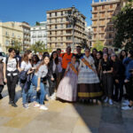 School group in Valencia, Spain, with two falleras