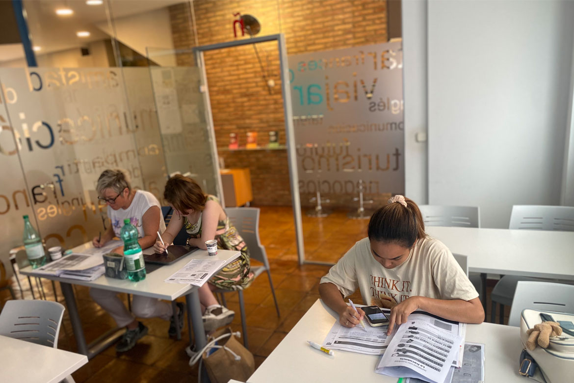 3 students writing during their Spanish course in Spain