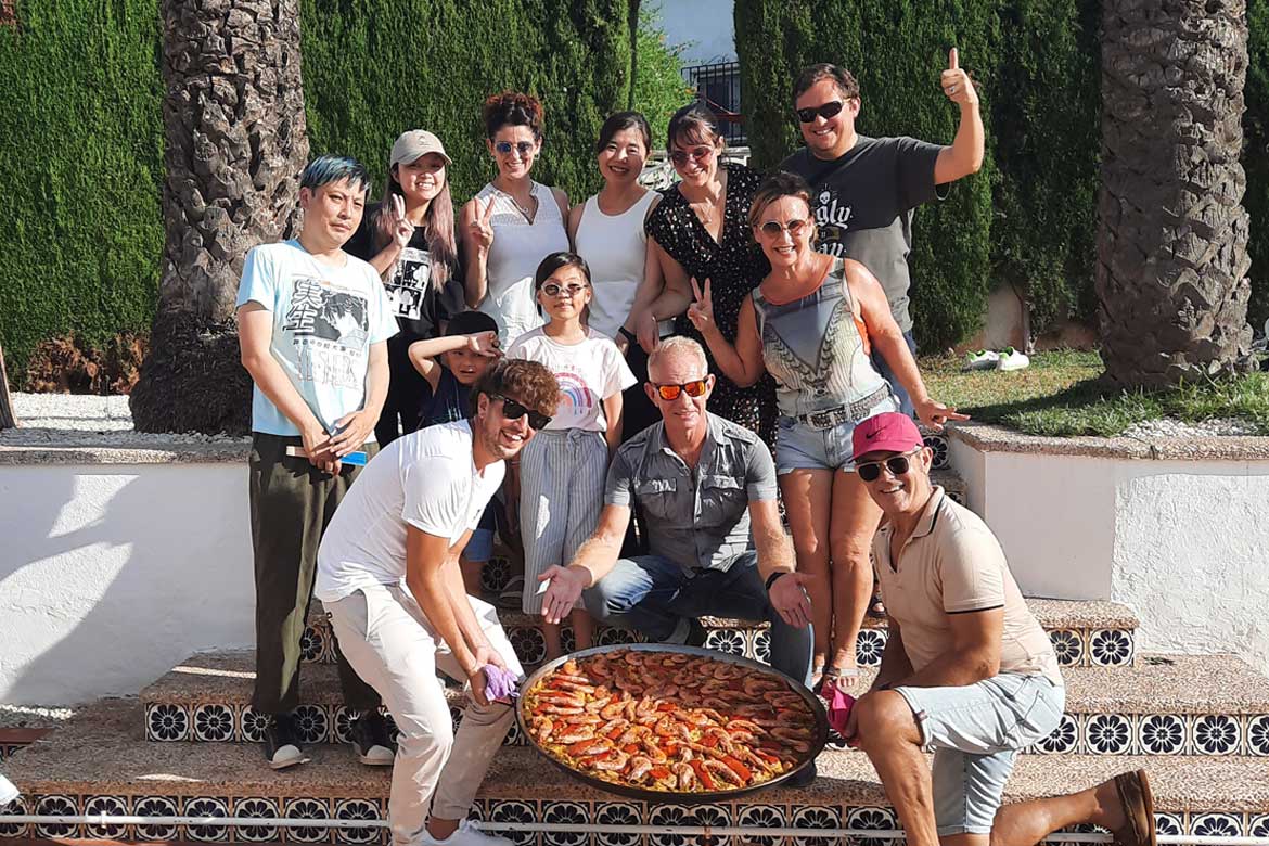 Students of Spanish with a paella, in Denia, Spain